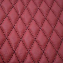 Quilted red leather with black single stitching 